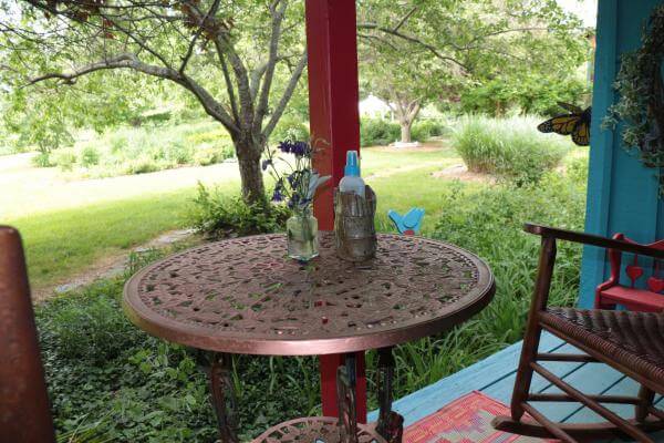 A table with a red umbrella on top of it.