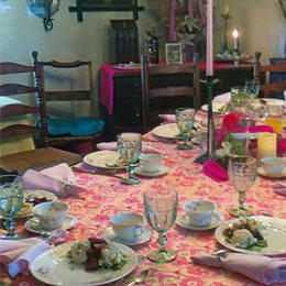 A table set with plates and cups on it