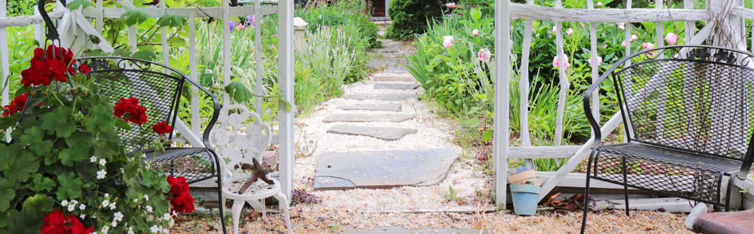 A walkway with stepping stones in the middle of it.