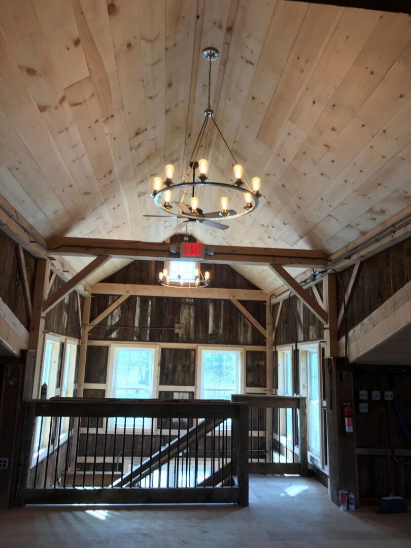 A large room with wooden walls and ceiling.