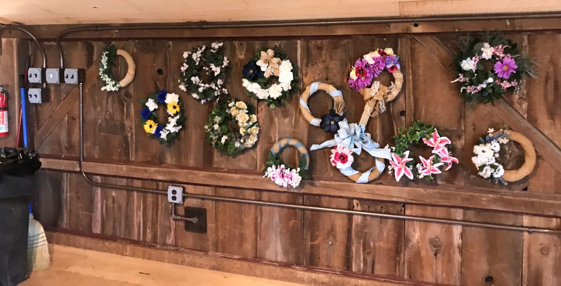 Assorted small wreaths with lilies and ribbons