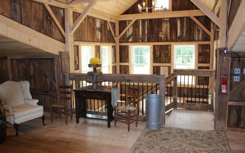 A room with wood floors and wooden walls.