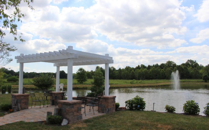 A gazebo sits in the middle of a park.