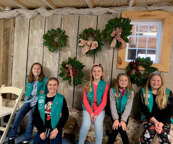 A group of girl scouts posing for a picture.