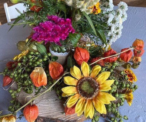 A table with flowers and leaves on it