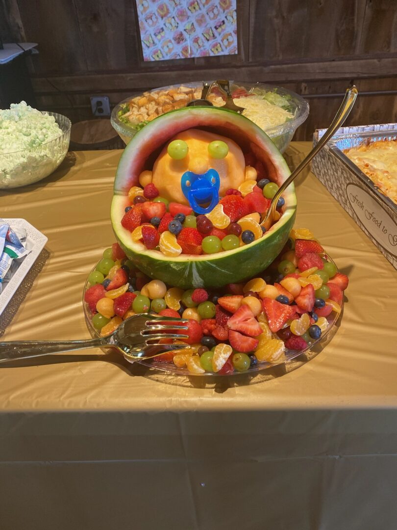 A bowl of fruit is on the table.